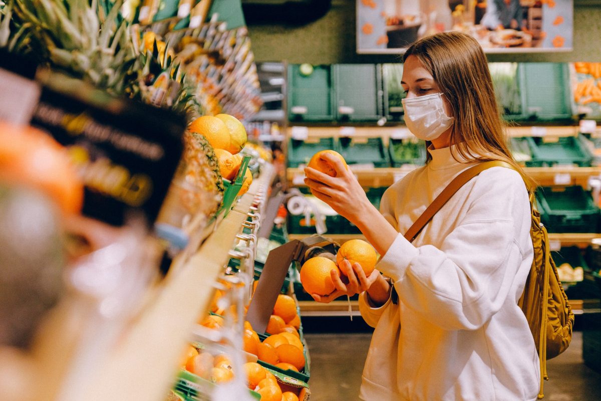 Budget Shopping For Oranges With A Mask